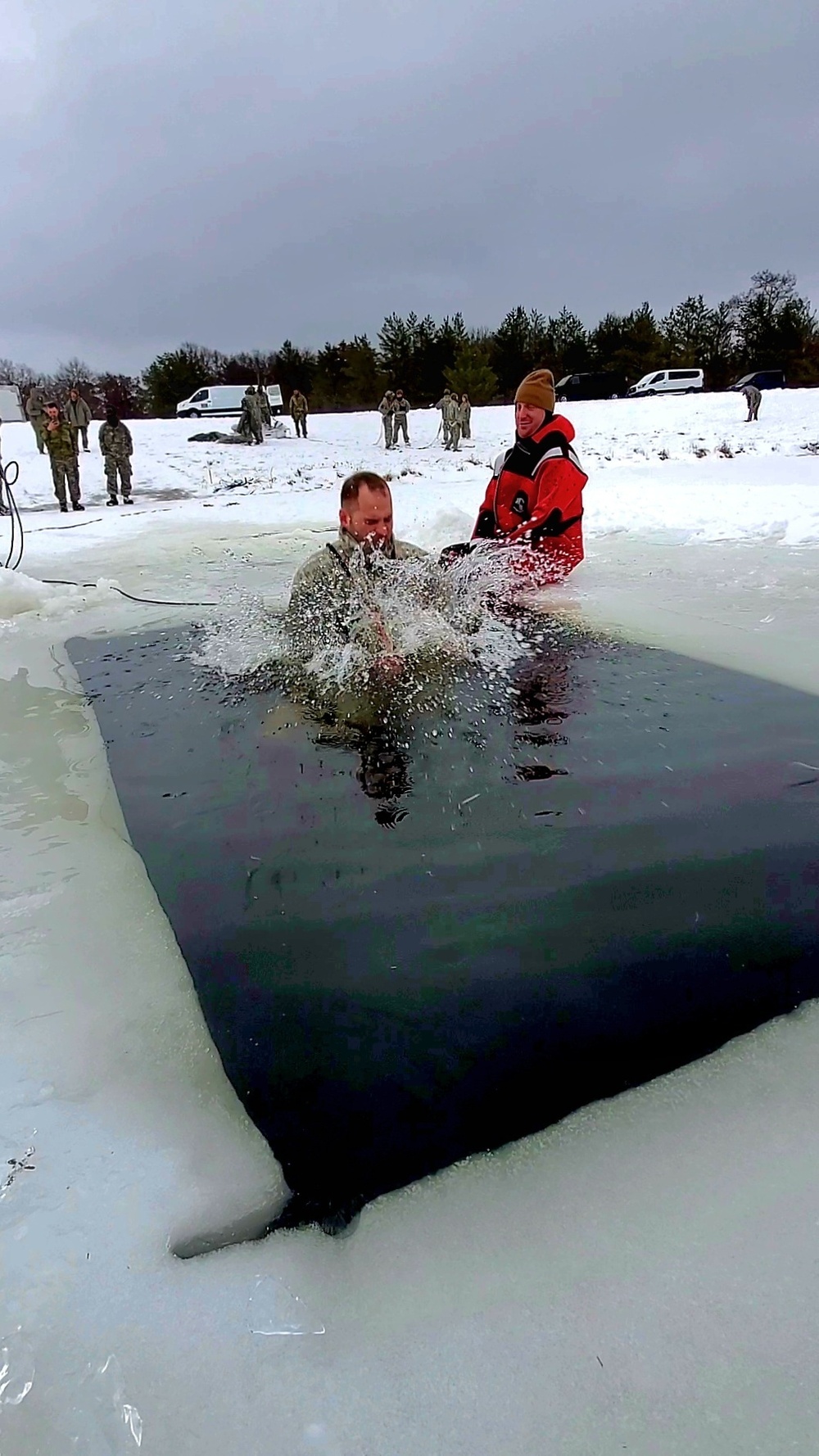 Airmen jump in icy Fort McCoy lake for January cold-water immersion training