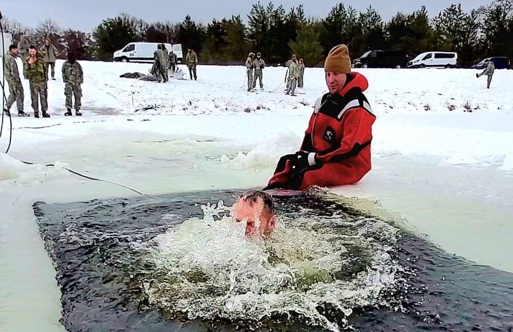 Airmen jump in icy Fort McCoy lake for January cold-water immersion training