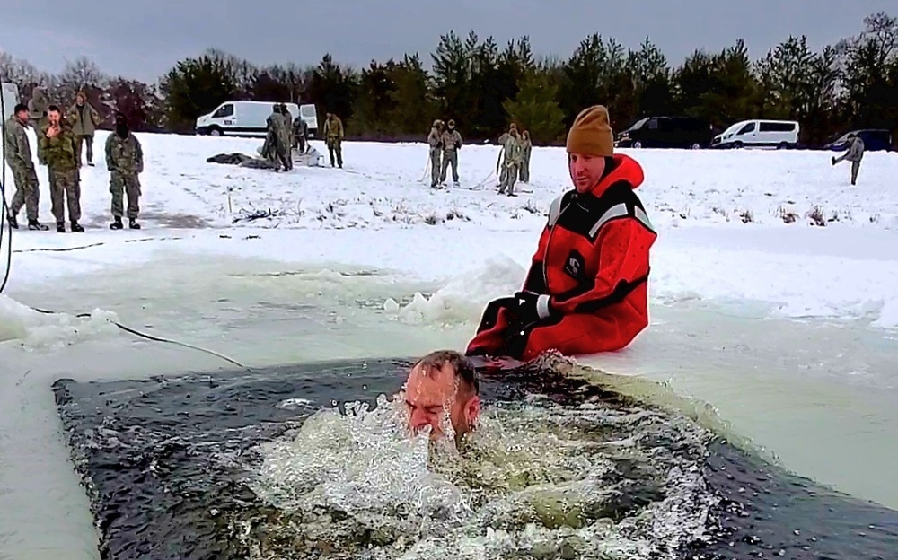 Airmen jump in icy Fort McCoy lake for January cold-water immersion training