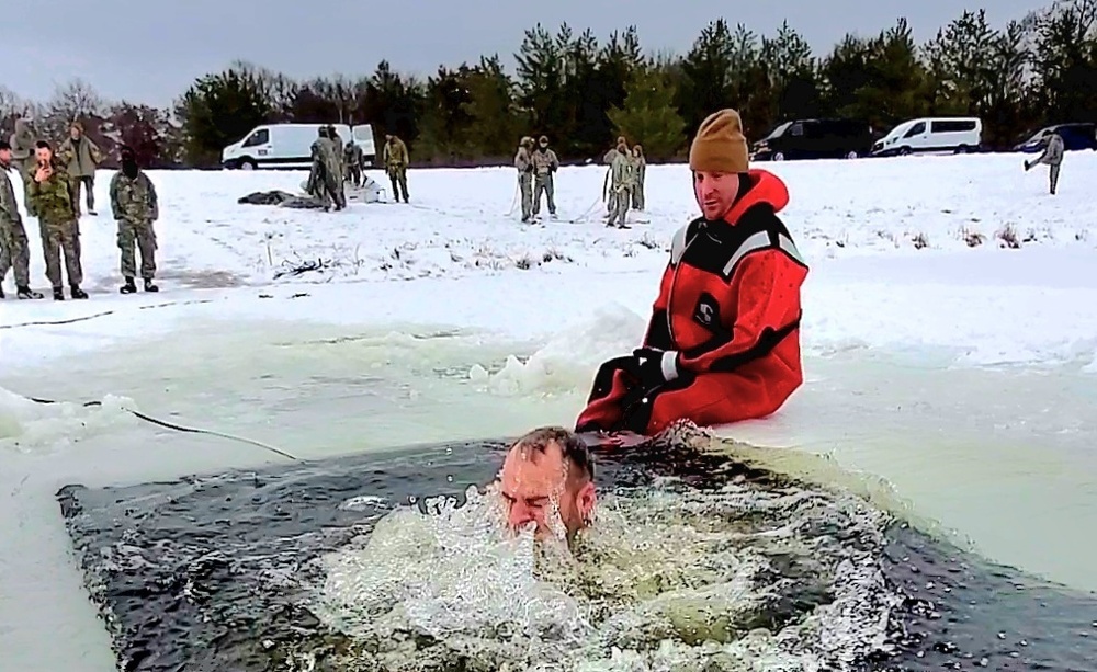 Airmen jump in icy Fort McCoy lake for January cold-water immersion training