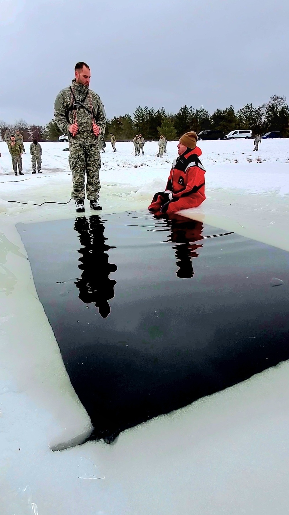 Airmen jump in icy Fort McCoy lake for January cold-water immersion training