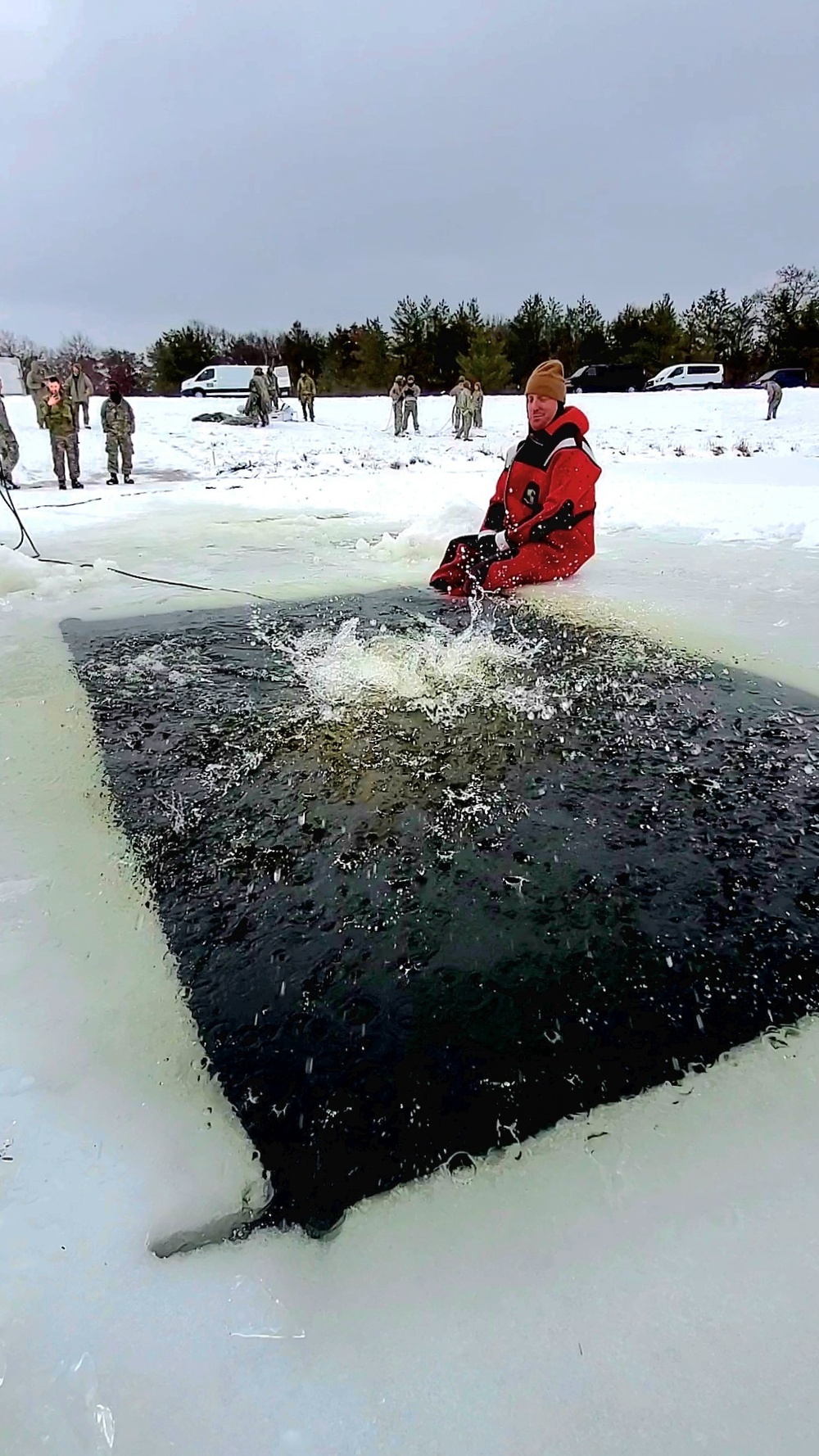 Airmen jump in icy Fort McCoy lake for January cold-water immersion training