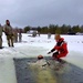 Airmen jump in icy Fort McCoy lake for January cold-water immersion training