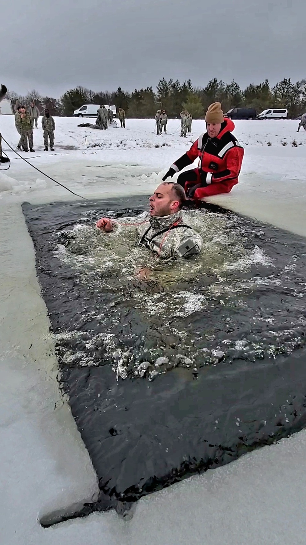 Airmen jump in icy Fort McCoy lake for January cold-water immersion training