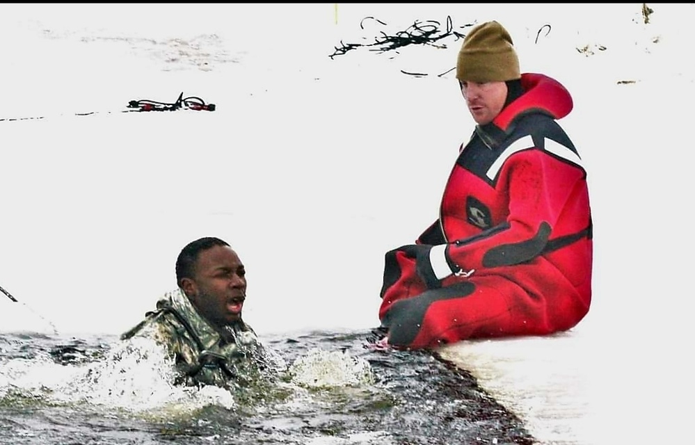 Airmen jump in icy Fort McCoy lake for January cold-water immersion training