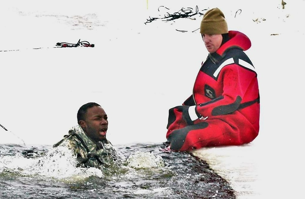 Airmen jump in icy Fort McCoy lake for January cold-water immersion training