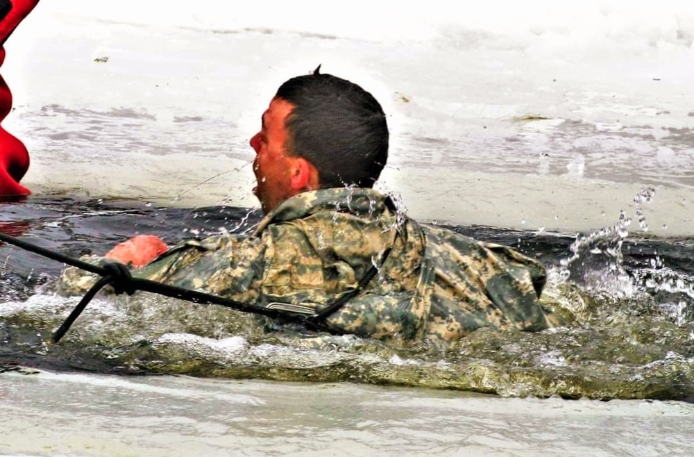 Airmen jump in icy Fort McCoy lake for January cold-water immersion training