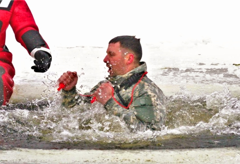 Airmen jump in icy Fort McCoy lake for January cold-water immersion training