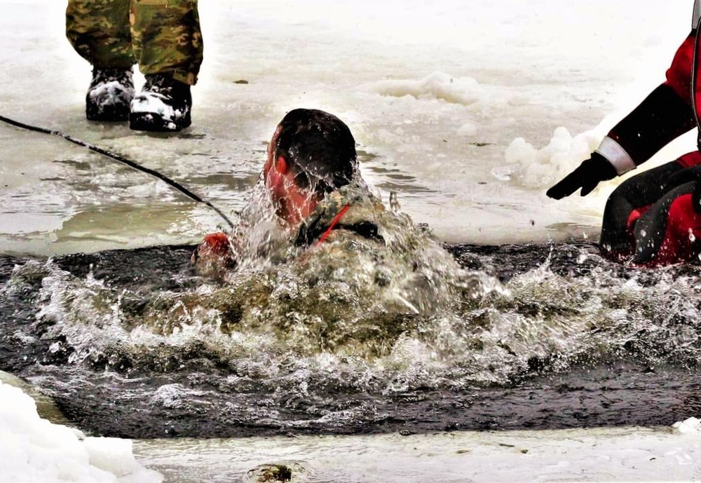 Airmen jump in icy Fort McCoy lake for January cold-water immersion training