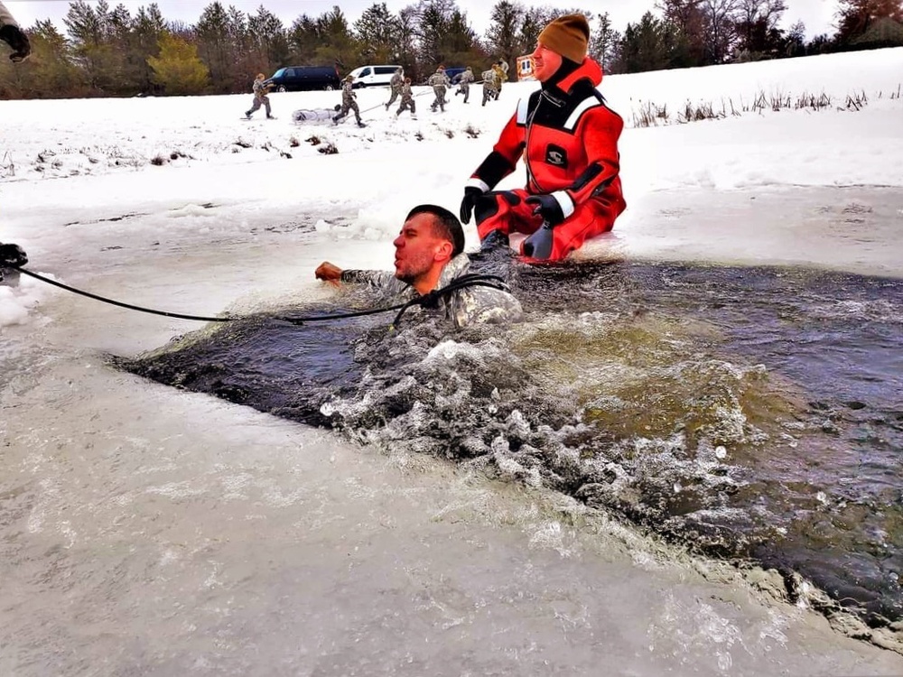 Airmen jump in icy Fort McCoy lake for January cold-water immersion training