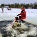 Airmen jump in icy Fort McCoy lake for January cold-water immersion training