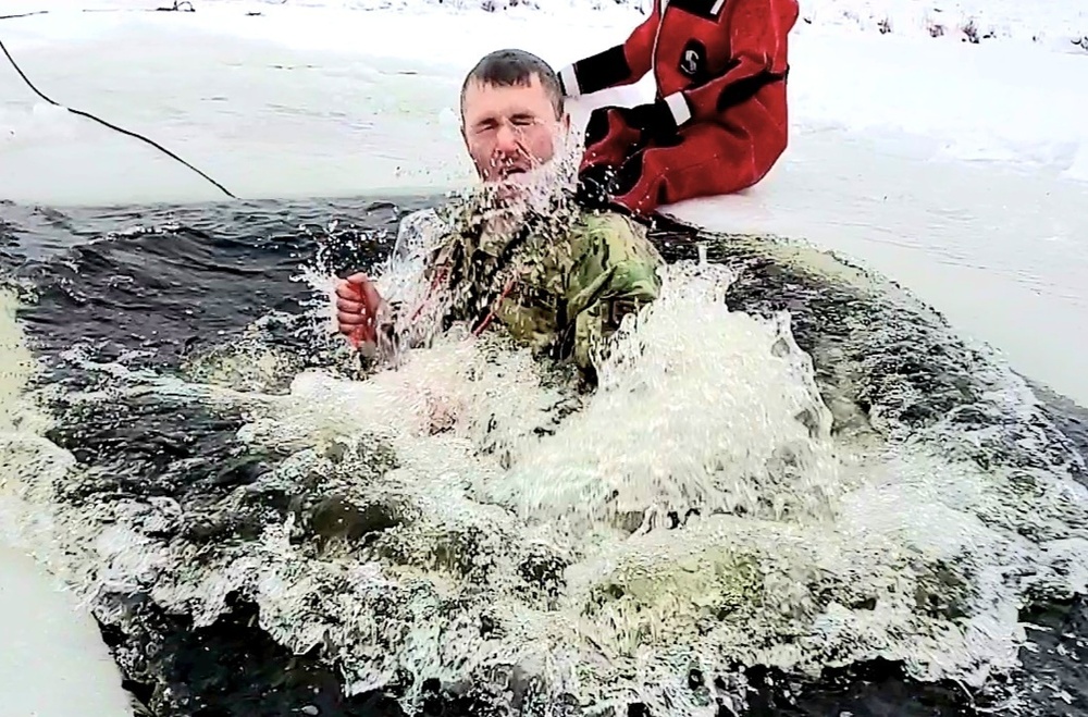 Airmen jump in icy Fort McCoy lake for January cold-water immersion training