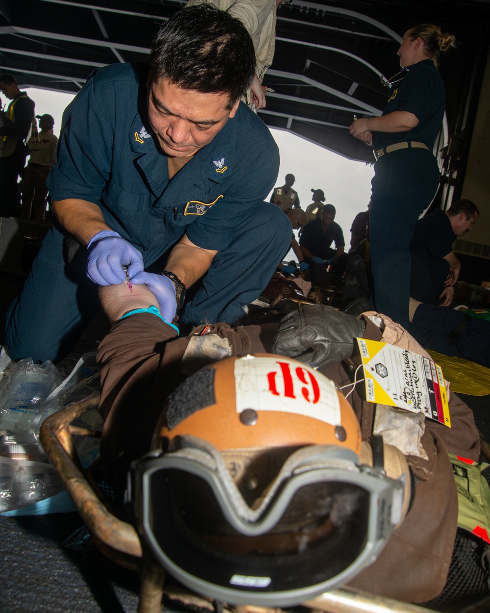 Sailor Administers IV Bag