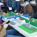 Visitors build LEGO ship models during Naval Museum's 12th Annual Brick by Brick: LEGO Shipbuilding event