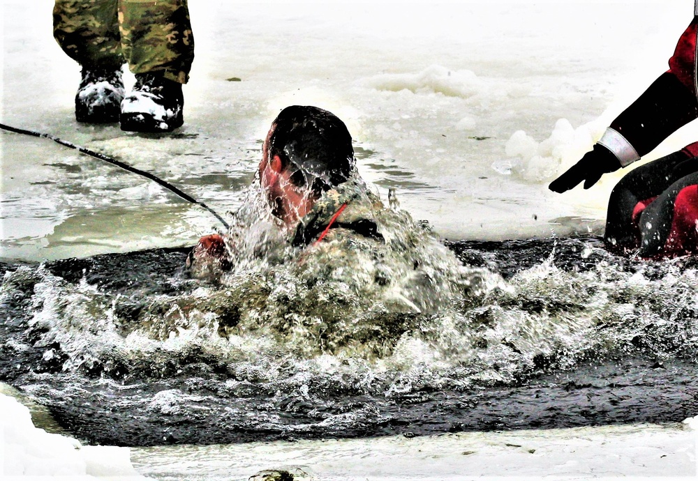 Airmen jump in icy Fort McCoy lake for January cold-water immersion training