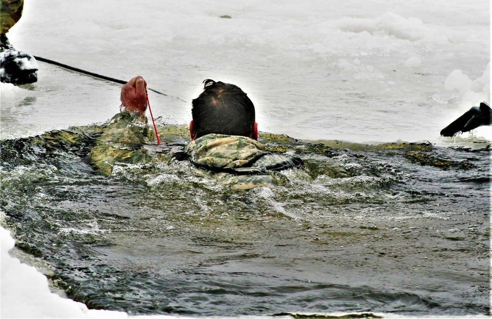 Airmen jump in icy Fort McCoy lake for January cold-water immersion training