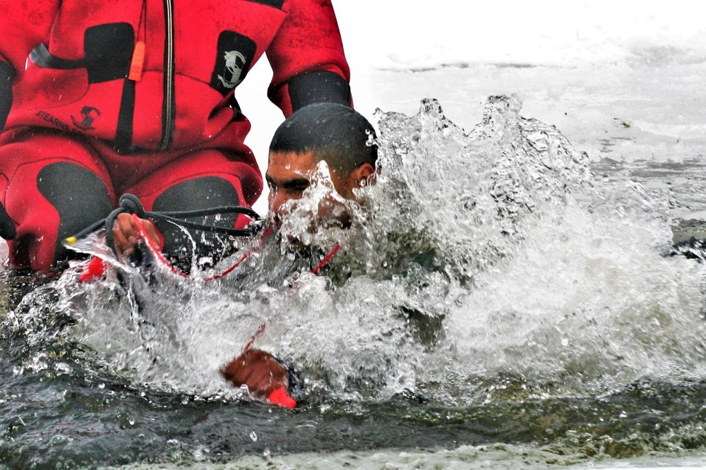 Airmen jump in icy Fort McCoy lake for January cold-water immersion training