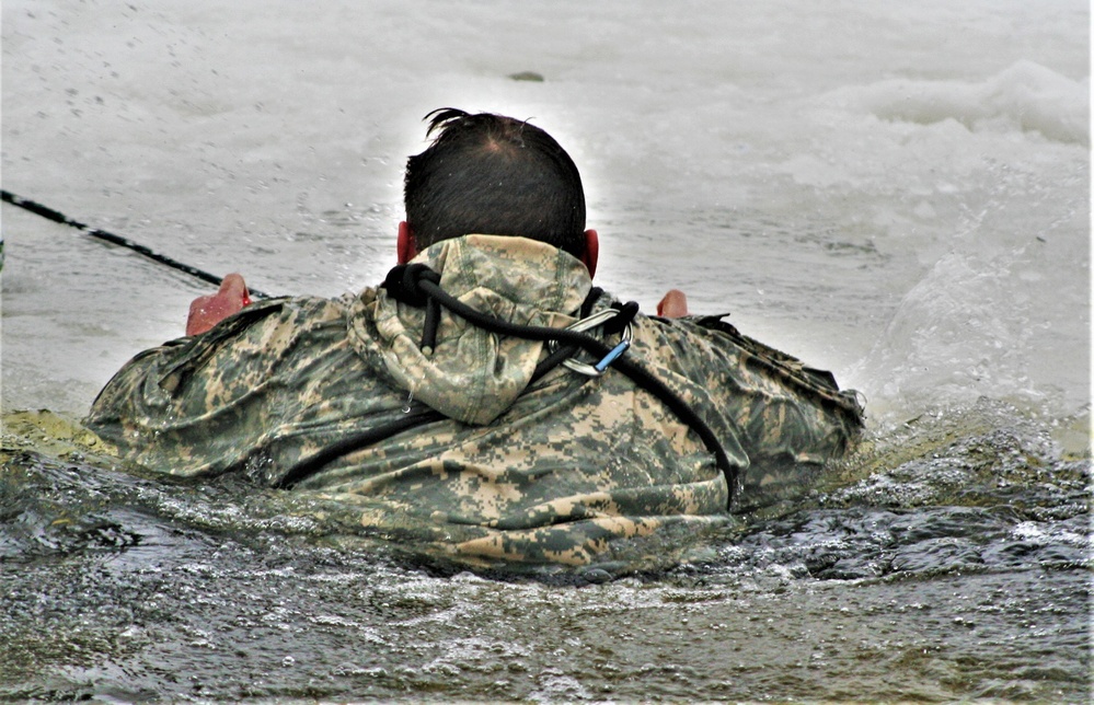 Airmen jump in icy Fort McCoy lake for January cold-water immersion training