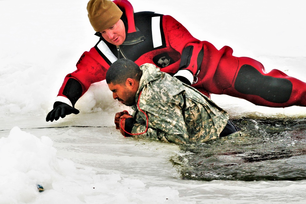 Airmen jump in icy Fort McCoy lake for January cold-water immersion training