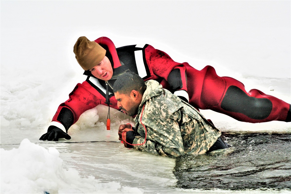 Airmen jump in icy Fort McCoy lake for January cold-water immersion training