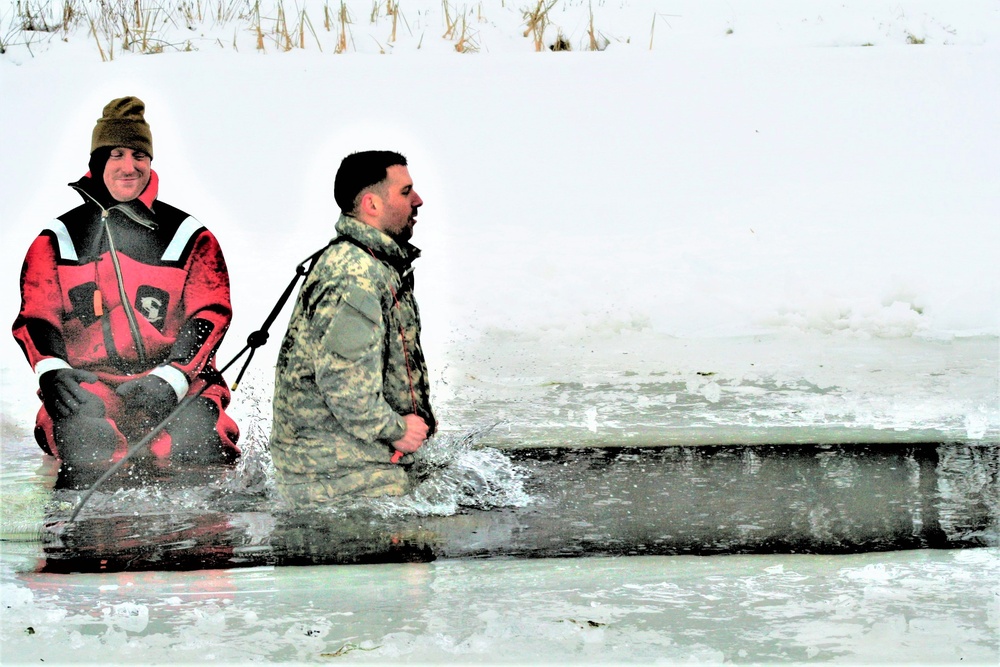 Airmen jump in icy Fort McCoy lake for January cold-water immersion training