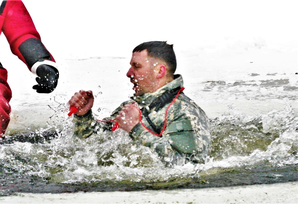 Airmen jump in icy Fort McCoy lake for January cold-water immersion training