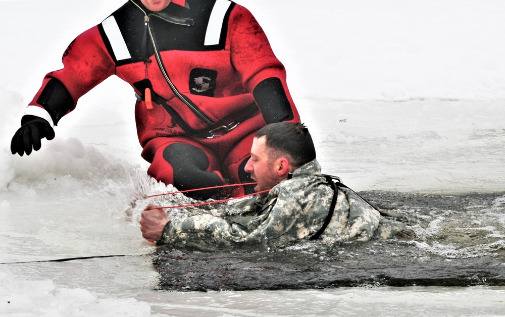 Airmen jump in icy Fort McCoy lake for January cold-water immersion training