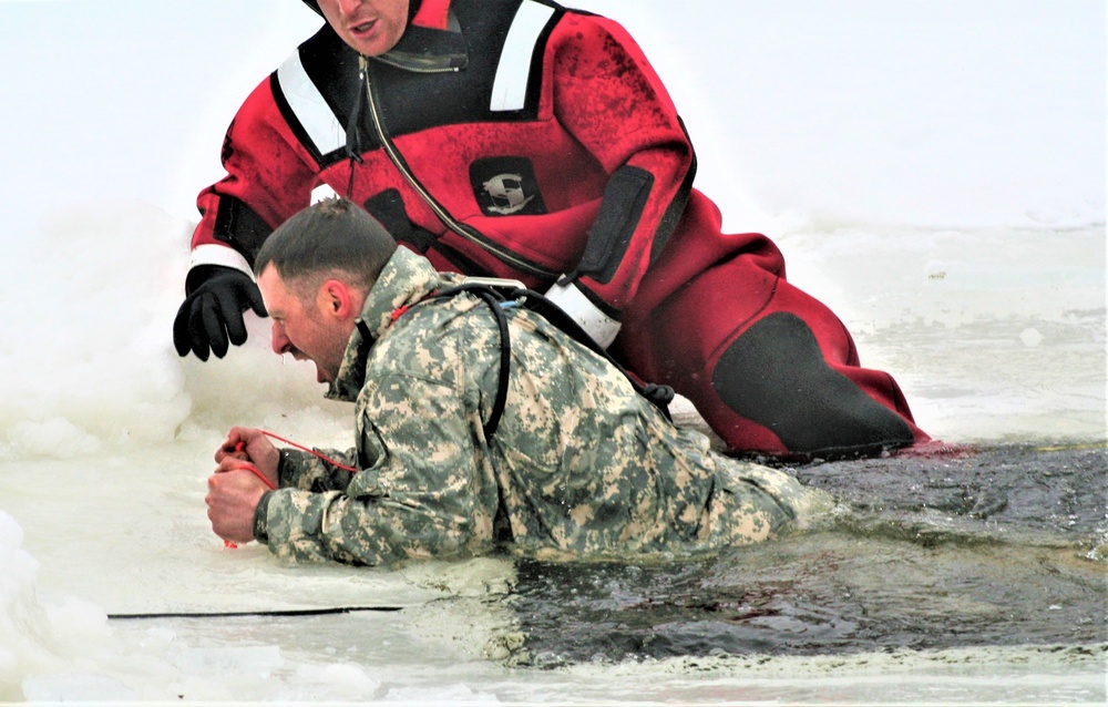 Airmen jump in icy Fort McCoy lake for January cold-water immersion training