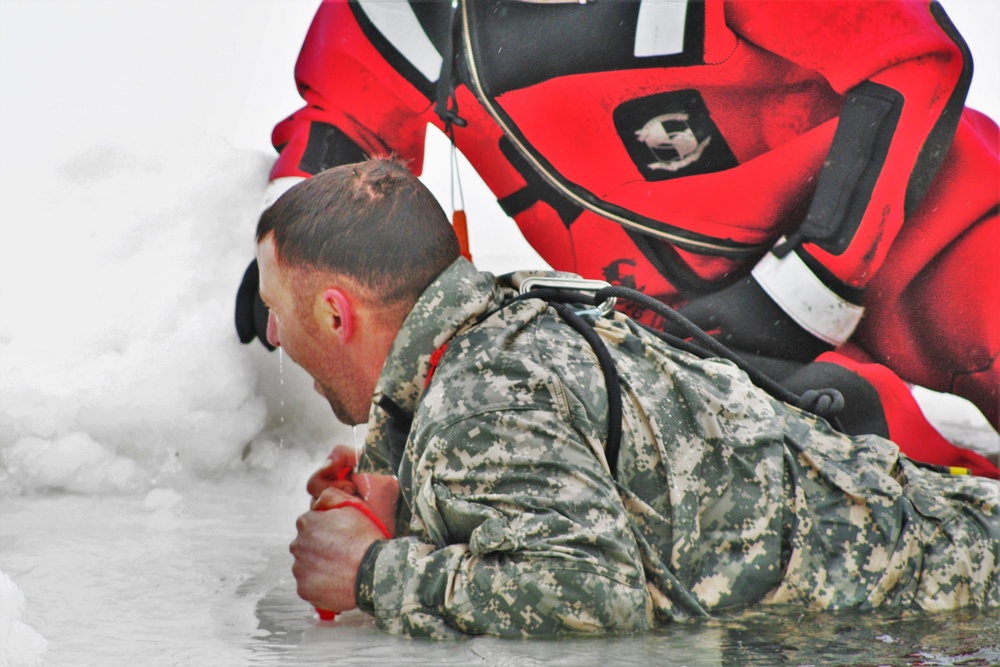 Airmen jump in icy Fort McCoy lake for January cold-water immersion training