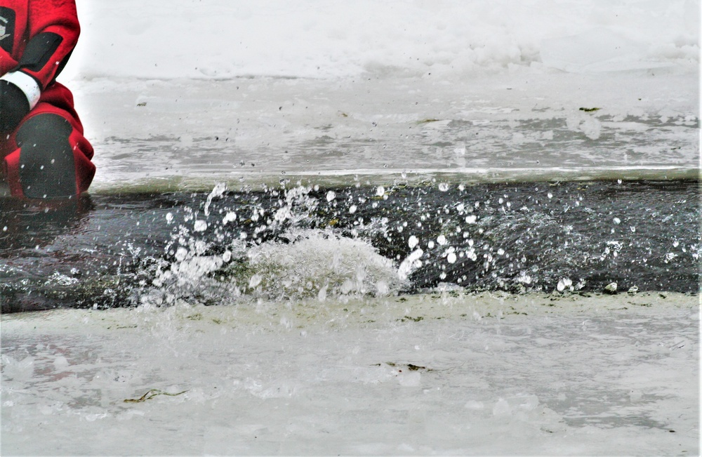 Airmen jump in icy Fort McCoy lake for January cold-water immersion training