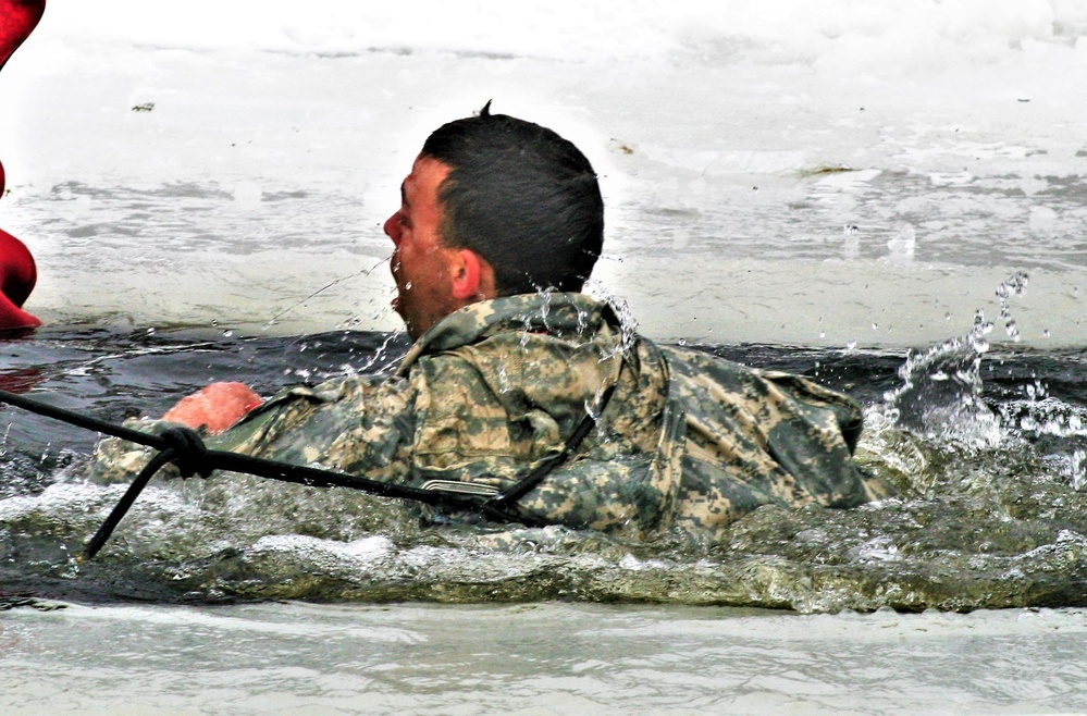 Airmen jump in icy Fort McCoy lake for January cold-water immersion training