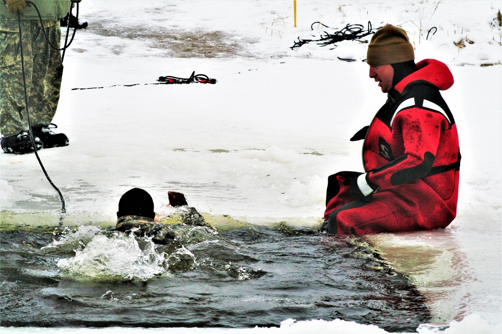 Airmen jump in icy Fort McCoy lake for January cold-water immersion training