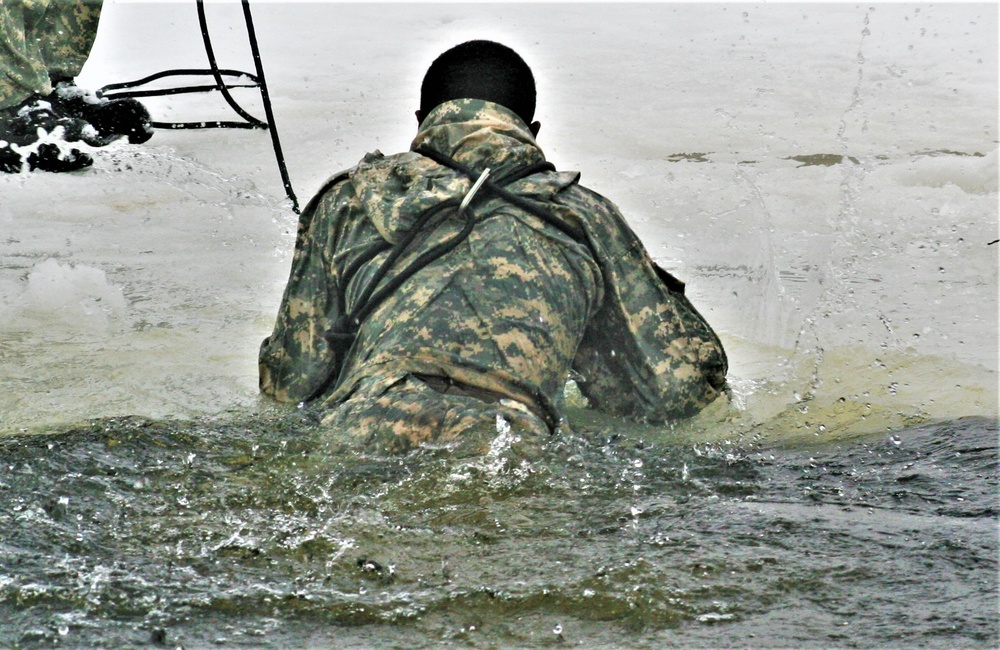 Airmen jump in icy Fort McCoy lake for January cold-water immersion training