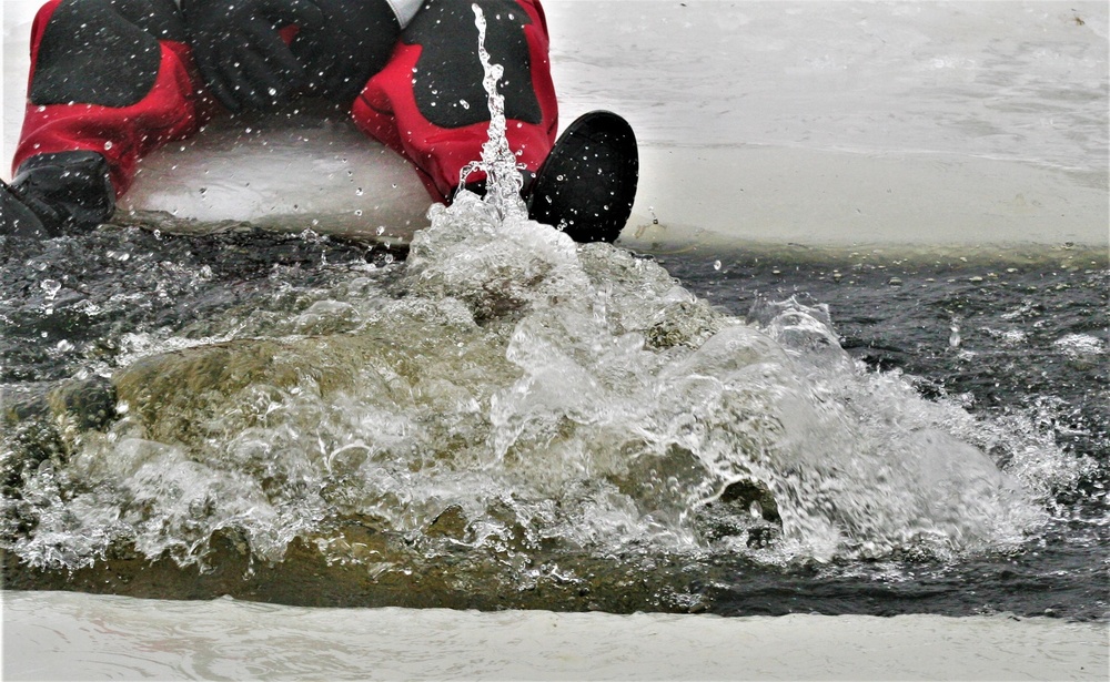 Airmen jump in icy Fort McCoy lake for January cold-water immersion training