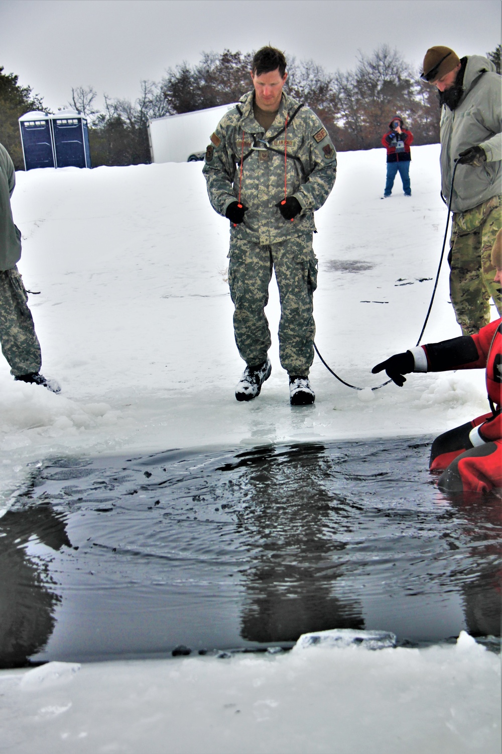 Airmen jump in icy Fort McCoy lake for January cold-water immersion training