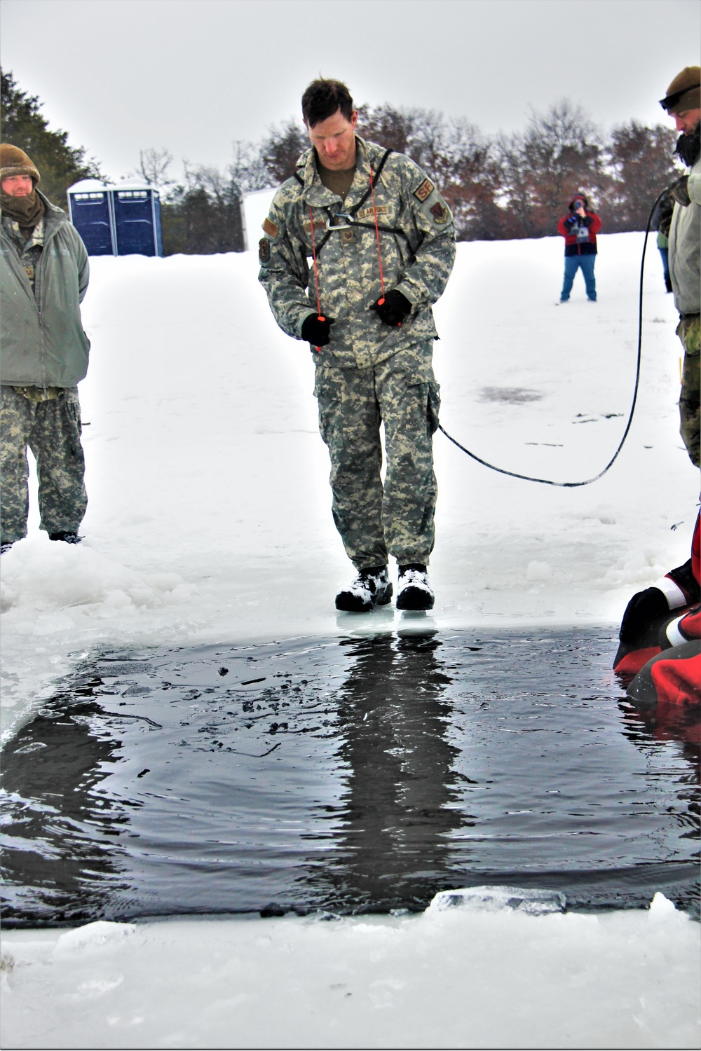 Airmen jump in icy Fort McCoy lake for January cold-water immersion training