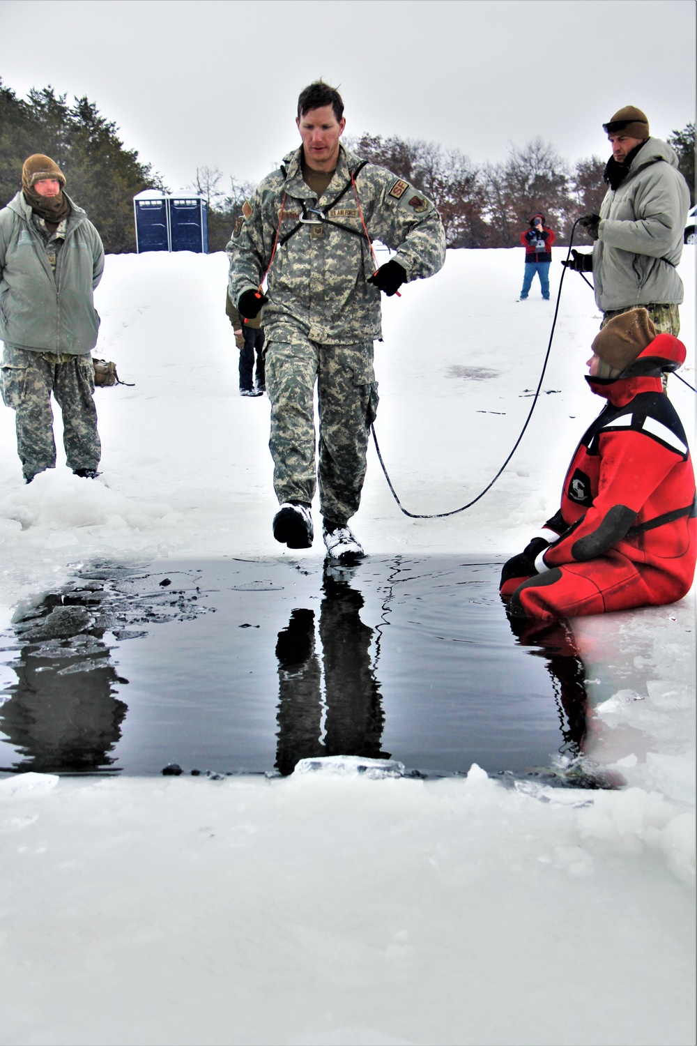 Airmen jump in icy Fort McCoy lake for January cold-water immersion training