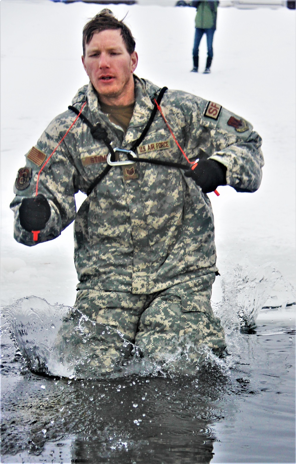 Airmen jump in icy Fort McCoy lake for January cold-water immersion training