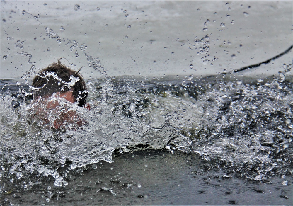 Airmen jump in icy Fort McCoy lake for January cold-water immersion training