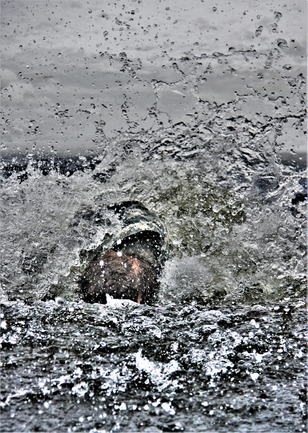 Airmen jump in icy Fort McCoy lake for January cold-water immersion training