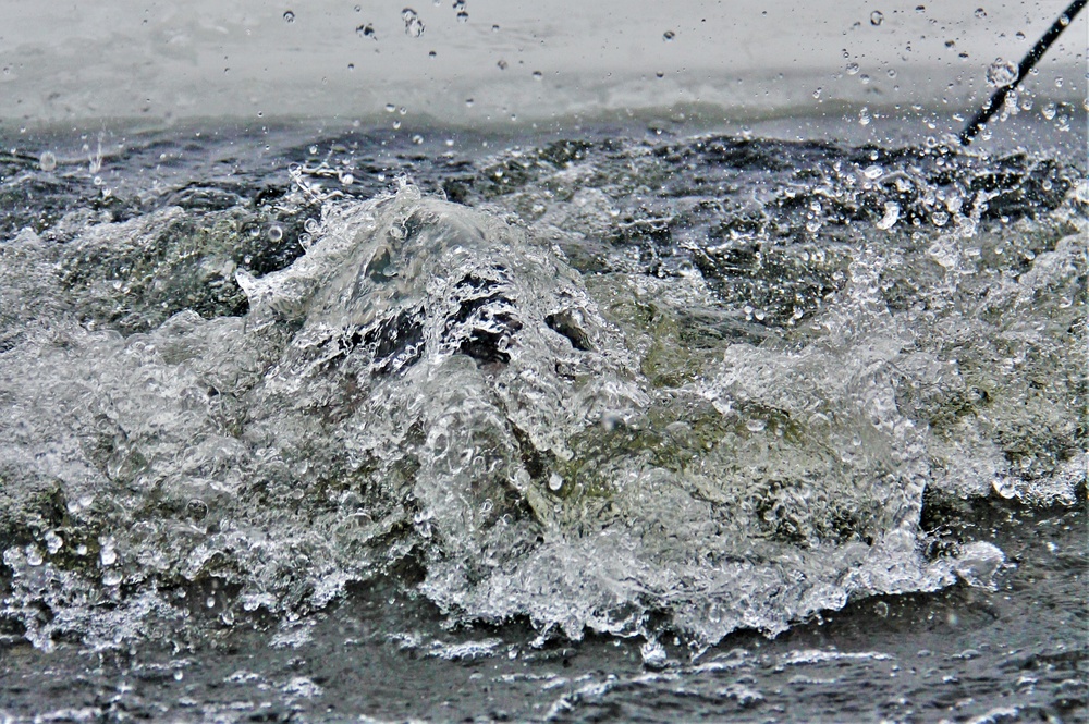 Airmen jump in icy Fort McCoy lake for January cold-water immersion training