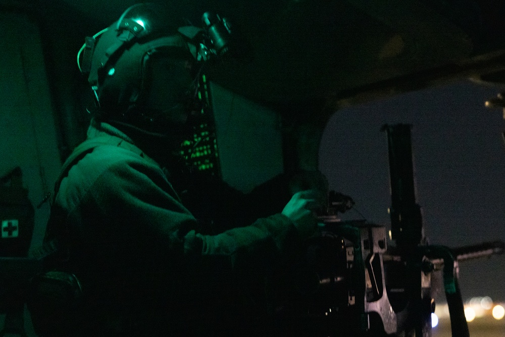 HMH-464 Marines fire into the night