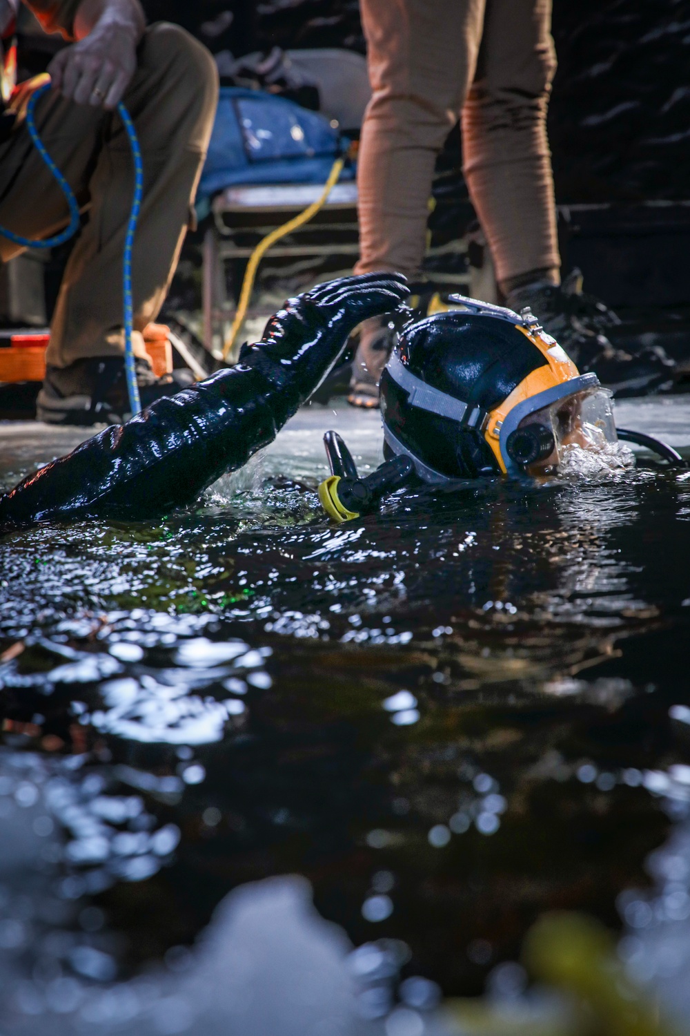 U.S. Navy Divers Perform Gear Checks During Ice Dive