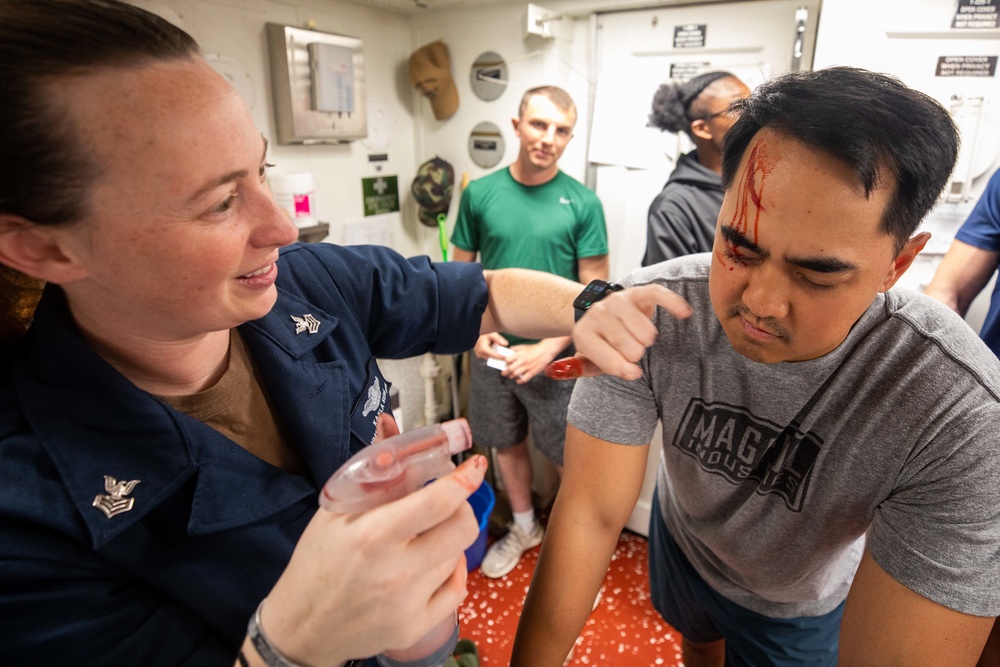 U.S. Navy Sailors prepare for mass casualty drill.