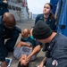 U.S. Navy Sailors conduct mass casualty drill.