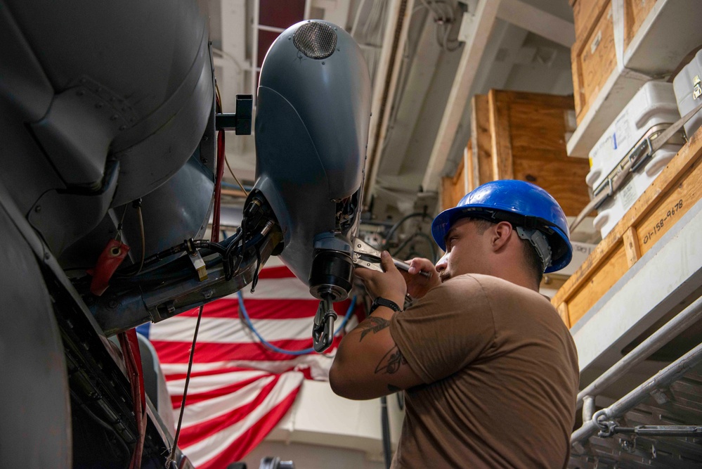 Sailor Performs Maintenance