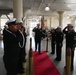 Capt. Ryan A. Baum salutes the side-boys and departs at the assumption of command ceremony as Commander, Navy Reserve, NAVSUP FLC San Diego