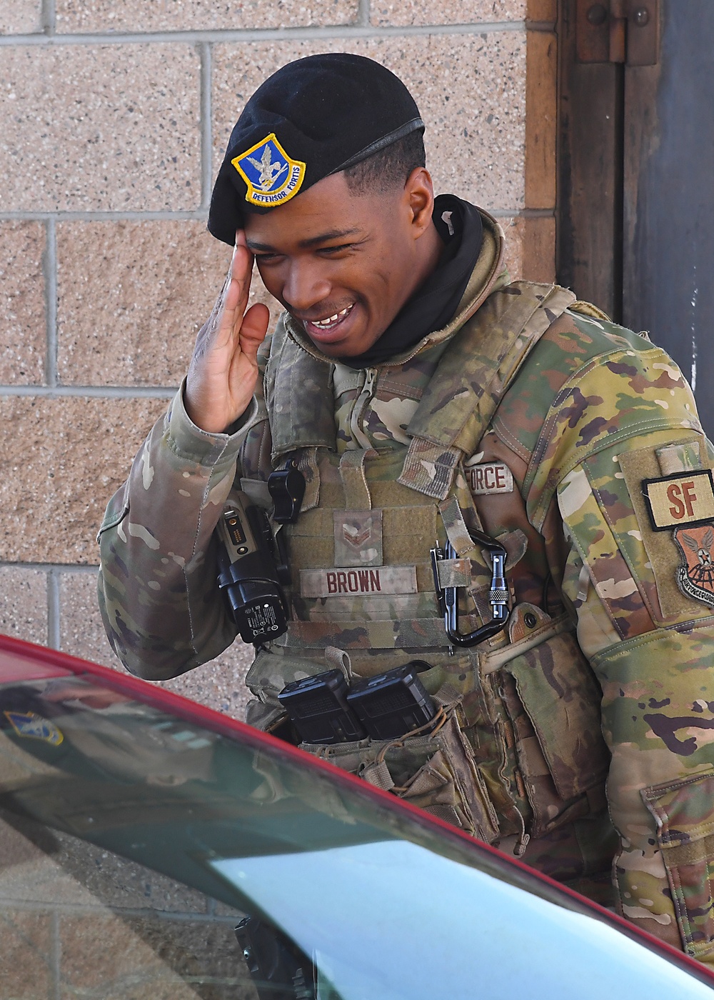 Brown salutes at Kirtland gate