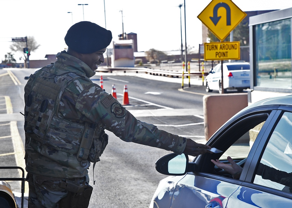 Brown checks identifications at Kirtland gate