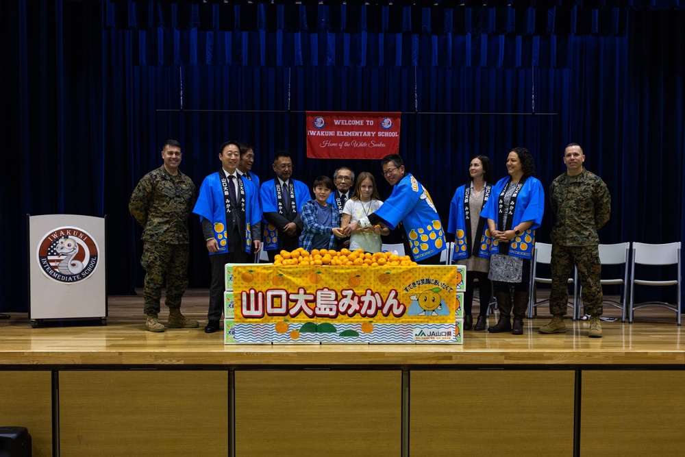 Harvesting Relationships: Marine Corps Air Station Iwakuni and Yamaguchi Prefectural personnel participate in Mikan presentation at Iwakuni Intermediate School